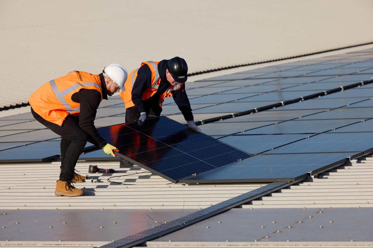 A solar panel lifted off the roof so the space underneath can be cleaned